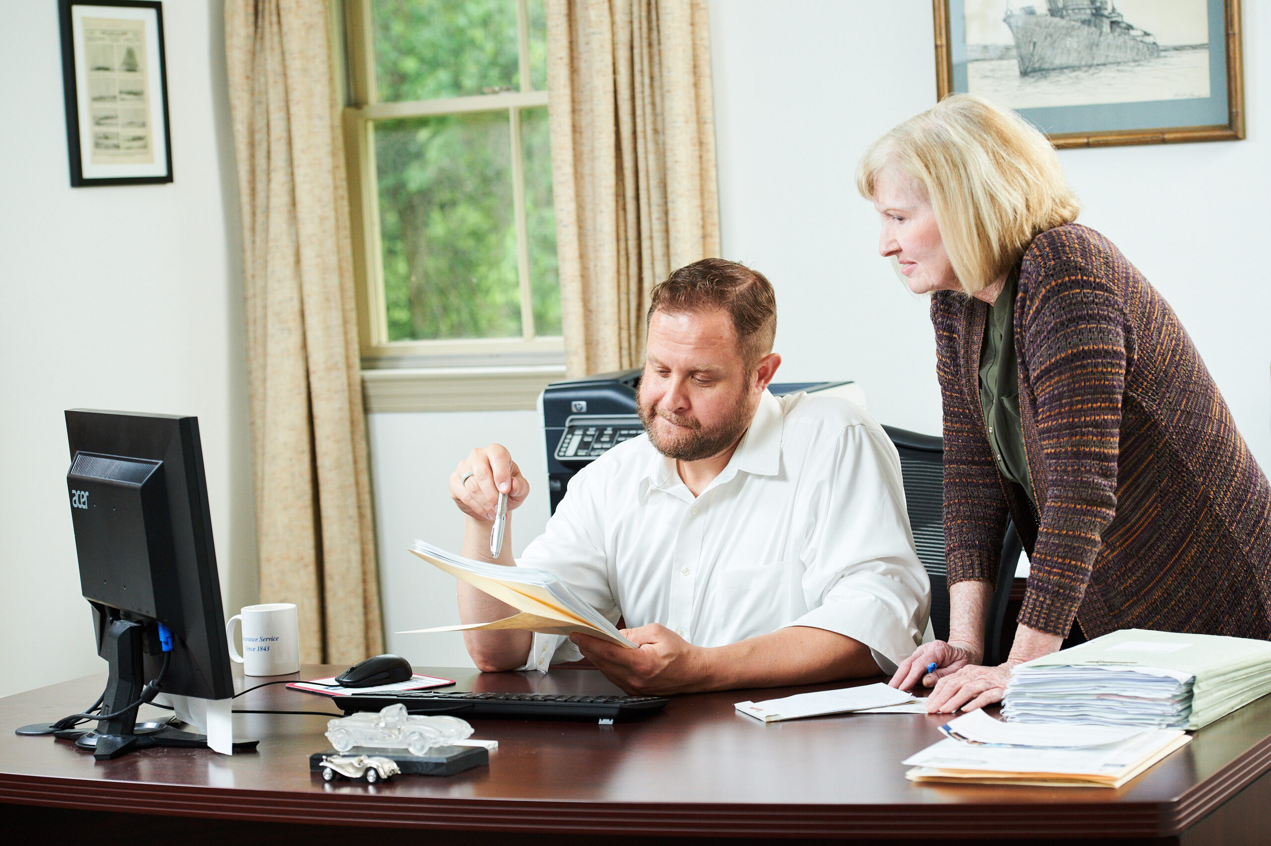 image of an employees working together at Tyson Insurance